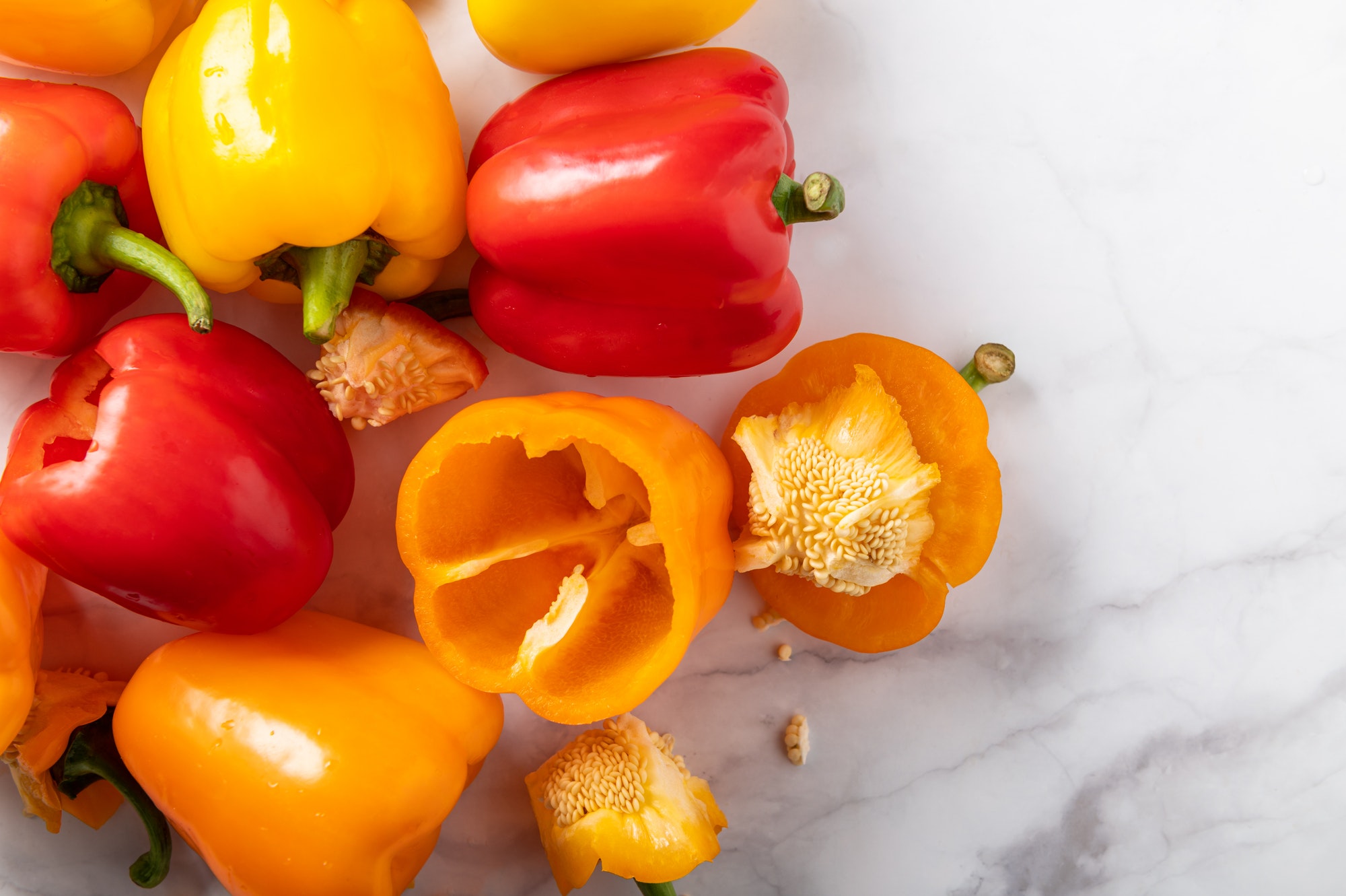 Orange, red and yellow bell peppers